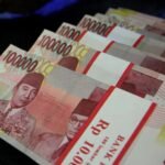 Rupiah Dibuka Melemah ke Rp17.879 per Dolar AS